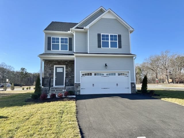 Aspen home plan built by Boyd Homes two story house with stone accent front.